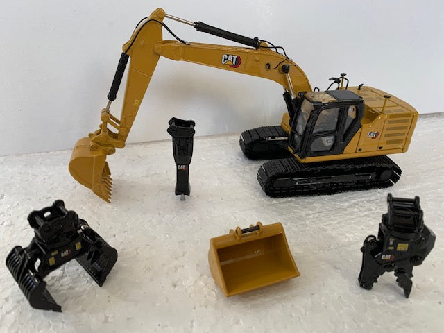 CAT 323 HYDRAULIC EXCAVATOR NEXT GENERATION with 4 WORK TOOLS. Scale 1:50